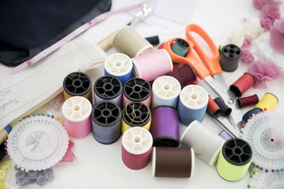 High angle view of sewing items on table