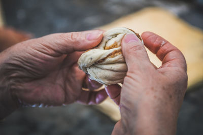Close-up of hand holding ice cream
