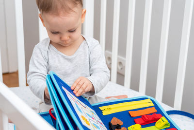 Boy playing with toy blocks