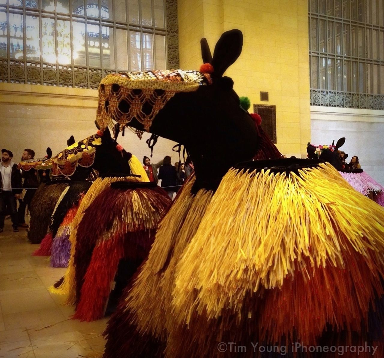 celebration, leisure activity, sitting, person, lifestyles, tradition, men, incidental people, arts culture and entertainment, rear view, cultures, building exterior, flower, art and craft, built structure, outdoors, full length, clear sky, standing