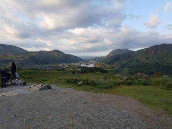 Scenic view of mountains against cloudy sky