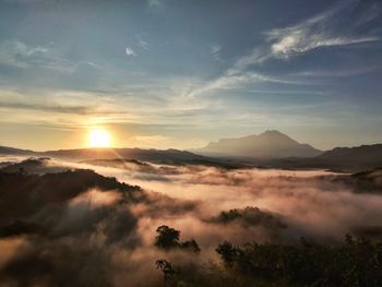 Scenic view of silhouette mountains against sky during sunset