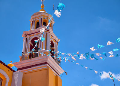 Low angle view of building against blue sky