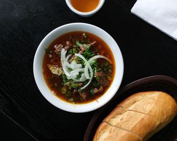 Directly above shot of serving soup in bowl