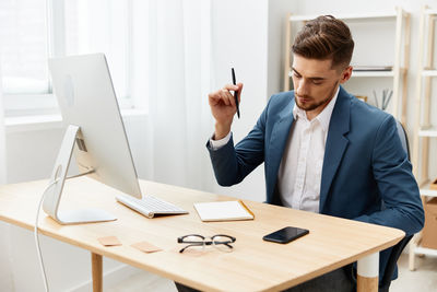 Businessman working at desk in office