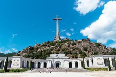 View of historical building and cross