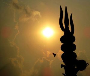 Low angle view of silhouette plant against sky during sunset