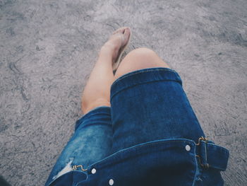 Low section of woman standing outdoors