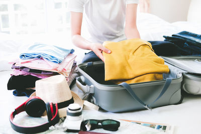 Midsection of woman standing at home