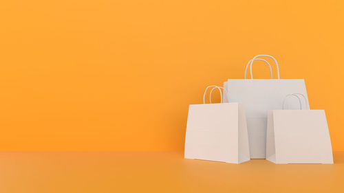 Close-up of text on paper against orange background