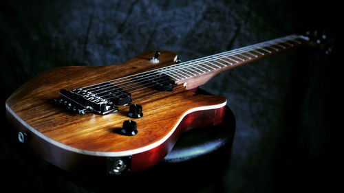 High angle view of electric guitar on a barstool 