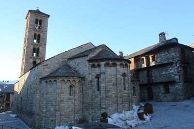 Old building against clear sky during winter