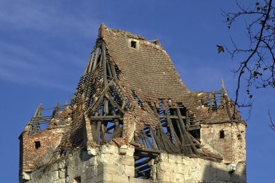 Low angle view of old building against sky