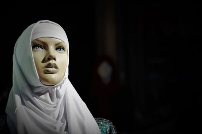 Close-up of mannequin wearing hijab in store