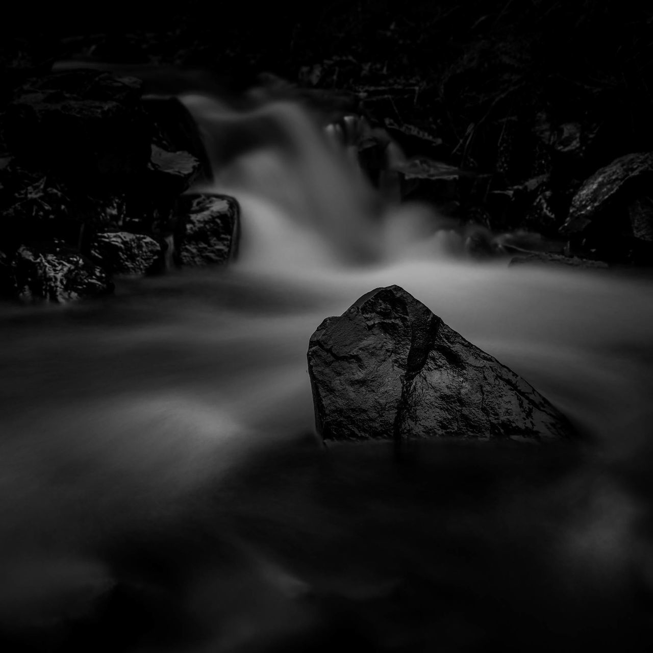 BLURRED MOTION OF ROCKS IN WATER
