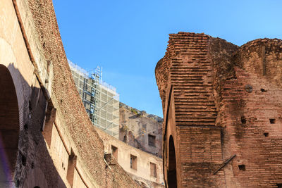 Low angle view of old ruins against clear sky