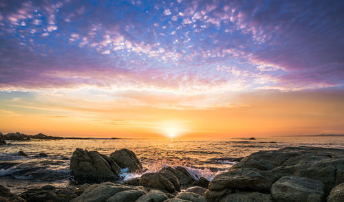 Scenic view of sea against sky during sunset