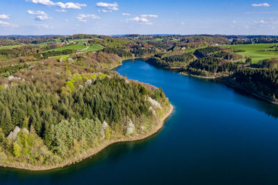 Scenic view of lake and trees against sky