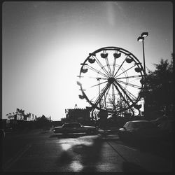 Low angle view of ferris wheel against sky