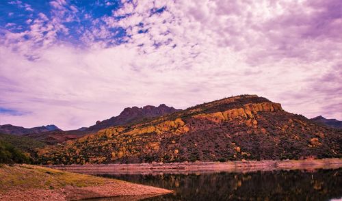 Scenic view of mountains against cloudy sky