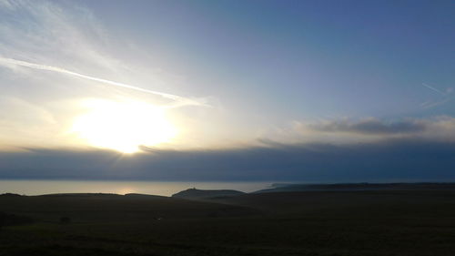 Scenic view of landscape against sky during sunset