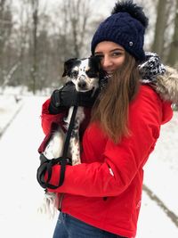 Portrait of a dog on snow during winter