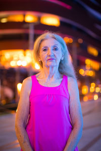 Portrait of woman standing at night