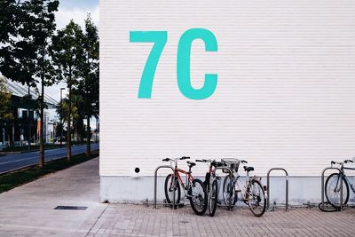 Sign on wall at bicycle parking lot