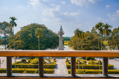 Trees outside temple against sky