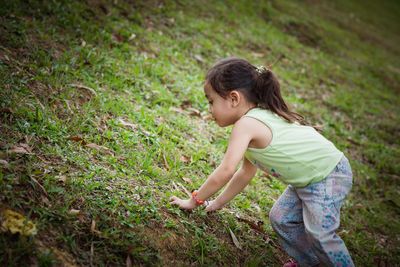 Side view of girl on field