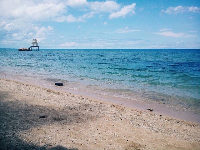 sea, water, sky, horizon over water, nautical vessel, beach, transportation, mode of transport, shore, boat, tranquil scene, tranquility, scenics, sand, cloud - sky, beauty in nature, nature, moored, cloud, idyllic