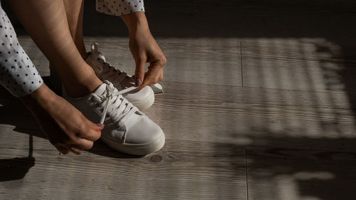 Low section of woman dancing on floor