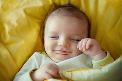 Cute baby boy sleeping in bed