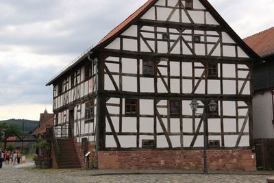 View of house against cloudy sky