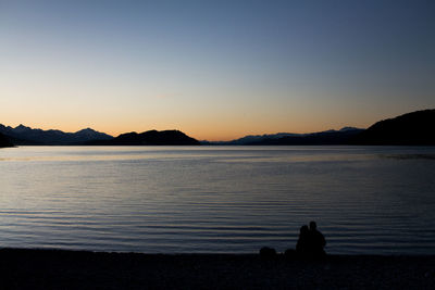 Scenic view of sea against clear sky during sunset