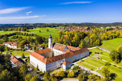 High angle view of trees and buildings against sky