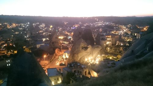 High angle view of illuminated buildings in city at night