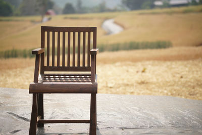 Empty chairs on field