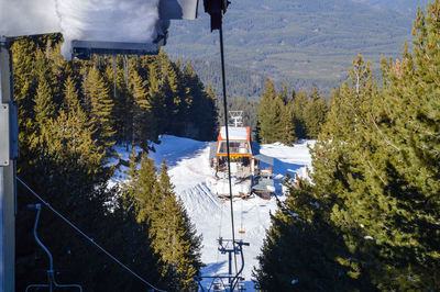 High angle view of ski lift over snowcapped mountains