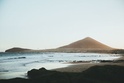 Scenic view of sea against clear sky