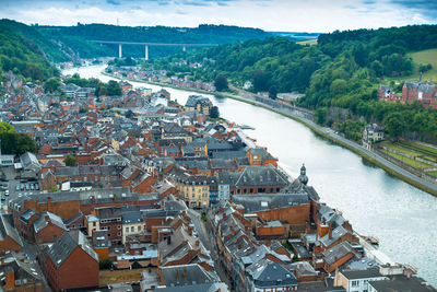 High angle view of river and cityscape against sky