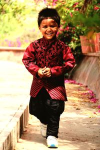 Portrait of smiling young man standing outdoors