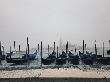 Boats in sea against sky