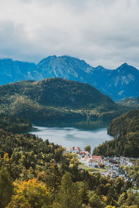 Scenic view of lake and mountains against sky