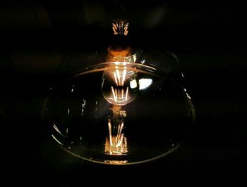 Close-up of illuminated light bulb