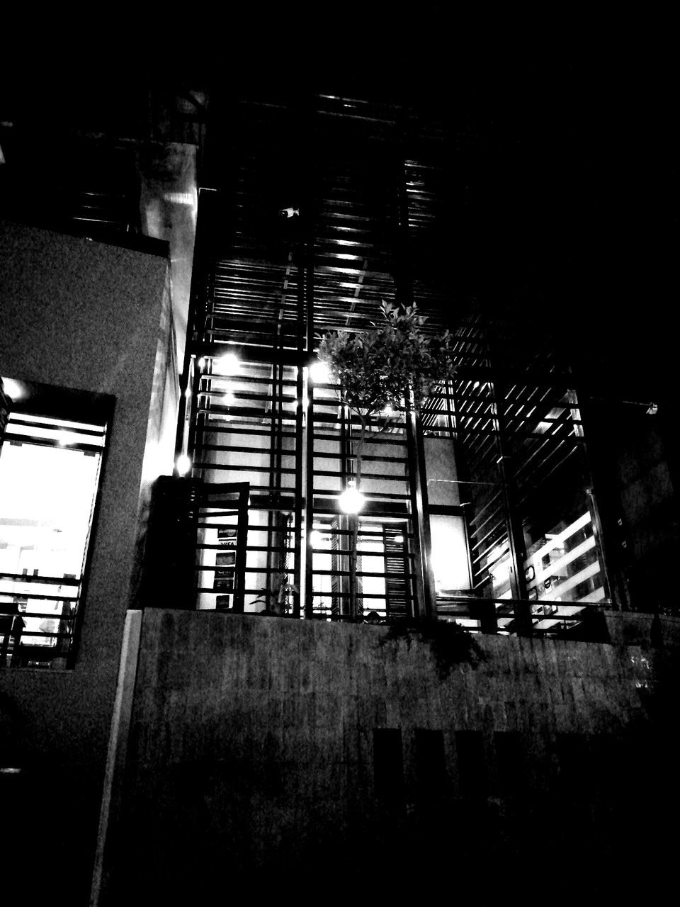 darkness, black, built structure, light, architecture, black and white, night, monochrome photography, building exterior, monochrome, white, low angle view, no people, building, lighting, nature, outdoors, window, city, reflection