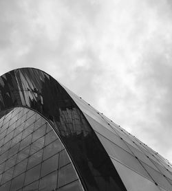 Low angle view of building against cloudy sky