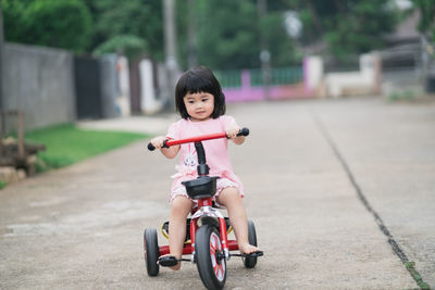 Portrait of cute boy riding bicycle