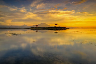 Scenic view of sea against orange sky