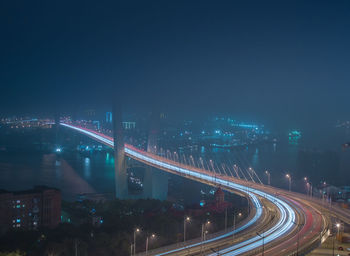 High angle view of light trails on road at night